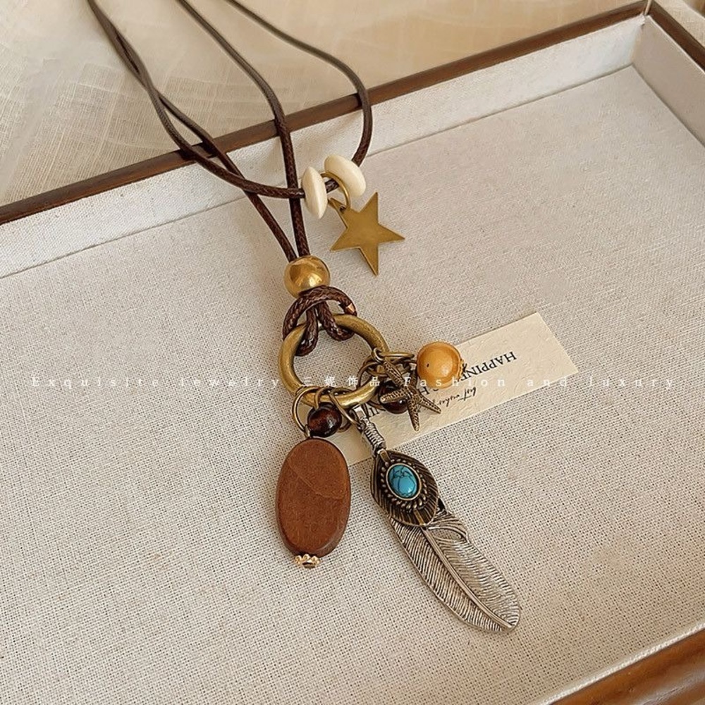 Bohemian Charm Necklace with Feather and Star Accents